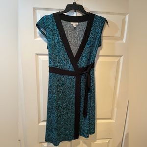 Knee length super comfy “wrap” dress.